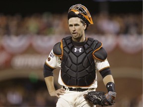 San Francisco Giants catcher Buster Posey reacts during the ninth inning of Game 4 of baseball's National League Division Series against the Chicago Cubs in San Francisco on Oct. 11, 2016.