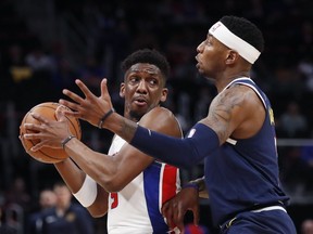 Detroit Pistons guard Langston Galloway looks to pass as Denver Nuggets forward Torrey Craig defends during the first half of an NBA basketball game, Monday, Feb. 4, 2019, in Detroit.