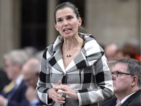 In this March 1, 2018, file photo, Minister of Science, Sport and Persons with Disabilities Kirsty Duncan rises during Question Period in the House of Commons. Calling the findings of a CBC investigation into abuse in amateur sport "tragic and completely unacceptable," Duncan says she wants "strong commitments from all partners" to move forward with a plan to protect athletes.