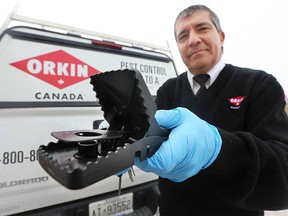 Shawn Pitre, an Orkin Canada technician, shows one of his rat-trapping devices on Feb. 26, 2019. Windsor is the sixth "rattiest" city in Ontario, according to Orkin Canada's annual ranking.