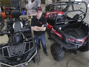 Steve Oliveira, co-owner of Oliveira Equipment in Comber, ON, is shown with damaged ATVs that thieves tried to steal recently. They did manage to get away with other vehicles worth $80,000.