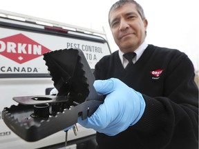 WINDSOR, ON. February 26, 2019. --  Shawn Pitre, a technician with Orkin Canada Pest Control in Windsor, ON. displays a rat snap trap on Tuesday, February 26, 2019. Windsor has been identified as one of the 'rattiest' cities in Ontario.