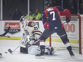 Windsor's Tyler Angle misses on a scoring opportunity against Peterborough goalie Hunter Jones during Thursday's game at the WFCU Centre.