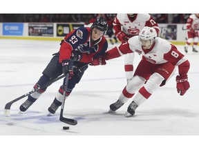 WINDSOR, ON. February 21, 2019. --  Jean-Luc Foudy, left, of the Windsor Spitfires and Jacob LaGuerrier of the Soo Greyhounds battle for the puck during their game on Thursday, February 21, 2019, at the WFCU Centre in Windsor, ON.