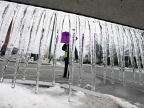 Icicles hang at Alsace Avenue in Windsor on Feb. 11, 2019, while a security guard assists motorists.