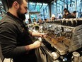 VANCOUVER, BC., December 11, 2018 -- Opening day action as Starbucks reveals its latest and largest store, the new Starbucks Reserve Bar in Vancouver, BC., December 11, 2018. This is the fourth Starbucks Reserve Bar format to open in Canada, earning Vancouver the distinction of being the only city in the country to offer two of these premium Starbucks specialty coffee experiences. The company opened its first Starbucks Reserve Bar in the citys Mount Pleasant community in May 2017. Its popularity sparked this new location in the heart of the thriving central business district. Ottawas ByWard Market and Torontos CF Shops at Don Mills are home to the other two locations. (NICK PROCAYLO/PostMedia)   00055616A ORG XMIT: 00055616A [PNG Merlin Archive]