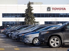 Parked cars line the parking lot at the Toyota plant in Cambridge, Ontario on Tuesday February 10, 2015. (File photo)