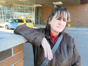 Mary Jane Gruenfeld stands at the Goyeau Street entrance of the Ouellette Campus of Windsor Regional Hospital on March 12, 2019. Gruenfeld was robbed of her car at the location on March 10, 2019, while she was helping her elderly wheelchair-bound father get into the vehicle.