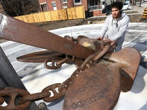 Terry Wood of Sandwich Teen Action Group (STAG) checks out a 8,000-pound boat anchor which has been installed at the Outdoor Marine Museum Park in Sandwich Towne.  The official opening of the park takes place Friday March 15 at 10 a.m.  The boat anchor will be part of the park plaza where groups can gather.  Additionally, the Marine Park will have history panels explaining some of the area's rich history.