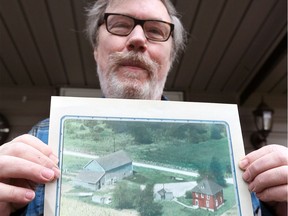 Gary Wells of St. Clair Beach has authored a book on Japanese Canadian internees who came to Essex County to labour on farms. Wells displays a photograph of the farm where internees stayed and worked. The farm was levelled to make way for the Highway 3 Essex bypass.