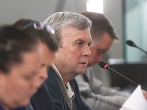 Homeowner Philip Gregory Goldhawk, centre, spoke against rezoning at Chris Taylor Auto Sales during City of Windsor's Development and Heritage Standing Committee meeting at City Hall Monday.