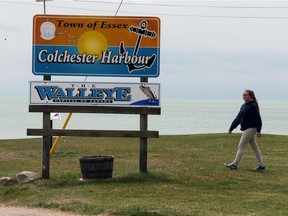 Colchester Harbour staff member Taylor Ross makes her rounds beside Colchester Beach on Lake Erie on May 19, 2017.