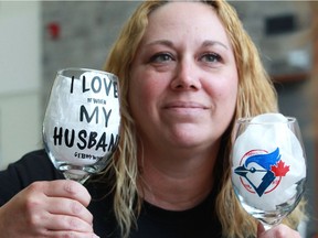 Kelly Tagliabracci of Fancy Glass by Kelly, displays hand painted glassware during the LaSalle Spring Market at LaSalle Civic Centre Saturday morning.  About 30 vendors displayed their products and live entertainer Justin Latam added soft rock tunes adding to the ambience.