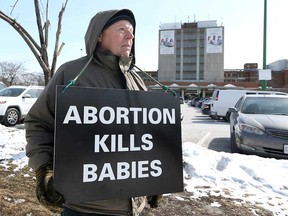 John Brown, a supporter of the anti-abortion 40 Days For Life campaign, stands vigil at Windsor Regional Hospital's Met Campus on March 7, 2019.