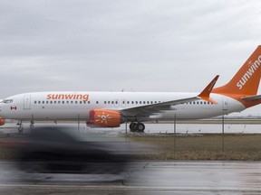 A pair of Sunwing's Boeing 737 Max 8's are parked at the Windsor International Airport, Thursday, March 14, 2019.