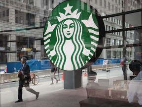 A sign hangs in the window of a Starbucks store on May 29, 2018 in Chicago, Illinois.