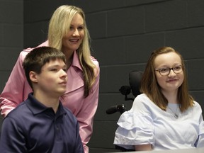 AM800's Kara Ro, middle, host of the 2019 Easter Seals Windsor-Essex telethon, poses for a photo with event ambassadors Eric Donavan McLeod, 15, left, and Serina Rose, 16, at the campaign's kickoff at St. Clair College on Wednesday, March 27, 2019.