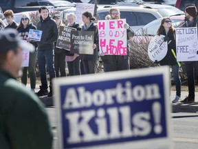 Pro-choice and anti-abortion protesters wage duelling rallies on Tecumseh Rd. East in front of Windsor Regional Hospital - Met Campus on March 23, 2019. The two groups, Feminists in Action, who are calling for a 150 metre buffer zone for anti-abortion protesters, and 40 Days for Life, an anti-abortion group that annually hold rallies during Lent, were intermingled as they held opposing signs.