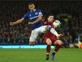 Everton's English striker Dominic Calvert-Lewin (L) vies with Liverpool's Scottish defender Andrew Robertson during the English Premier League football match between Everton and Liverpool at Goodison Park in Liverpool, north west England on March 3, 2019.