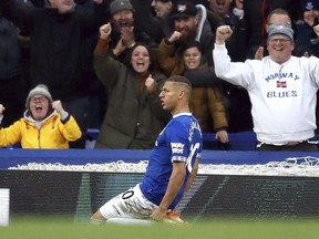 Everton's Richarlison celebrates scoring his side's first goal of the game, during the English Premier League soccer match between Everton and Chelsea at Goodison Park in Liverpool, England, Sunday March 17, 2019.
