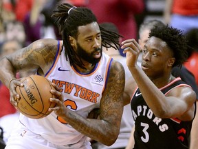 Toronto Raptors forward OG Anunoby shadows New York Knicks centre DeAndre Jordan during first half NBA basketball action in Toronto on March 18, 2019.