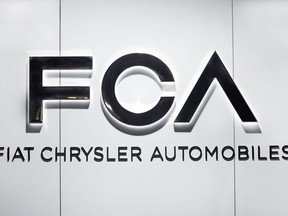 FILE - In this Monday, Jan. 14, 2019 file photo, Fiat Chrysler Automobiles FCA logo is shown at the North American International Auto Show in Detroit.