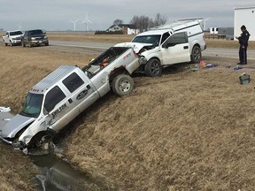 OPP officers deal with the scene of a four-vehicle incident on Highway 77 near 10th Concession in the Leamington area on March 13, 2019.