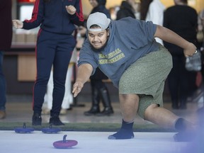 R.J. Sivanesan takes part in Ice Cream and Curling in the CAW Student Centre, Thursday, March 28, 2019.  The free event, which had two curling pads and free gelato, was put on by the Student Centre.