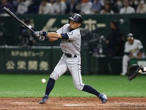 Seattle Mariners' Ichiro Suzuki fouls off a ball against the Oakland Athletics at Tokyo Dome in Tokyo, Wednesday, March 20, 2019.