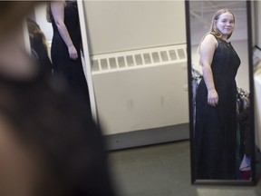 Jessi Harrington, 17, a Grade 12 student at Belle River high school, tries on a dress at Say Yes to the Dress at New Beginnings, Saturday, March 16, 2019.