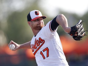Baltimore Orioles starting pitcher Alex Cobb (17) works against the Minnesota Twins in the first inning of a spring training baseball game Saturday, March 23, 2019, in Sarasota, Fla.
