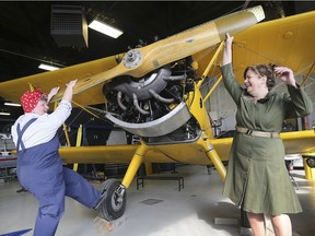 Mary Guthrie, left, and Margaret Moore, are shown in vintage outfits on Tuesday, March 19, 2019, at the Canadian Historical Aircraft Association with a 1941 Boeing Stearman open-cockpit biplane. They are organizing a 1940's themed fundraiser for the club's 75th anniversary.