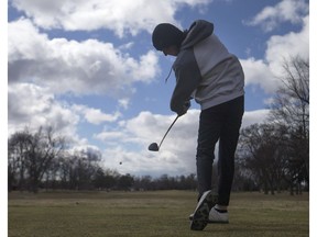 John Callis, 21, tees off on the first hole at Roseland Golf and Curling Club, Friday, March 22, 2019.