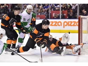 Philadelphia Flyers goaltender Brian Elliott (37) makes a save on the Toronto Maple Leafs during first-period NHL hockey action in Toronto on March 15, 2019.