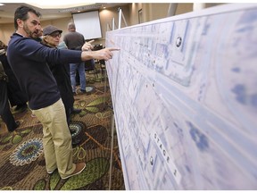 A public information session hosted by the City of Windsor and Dillon Consulting to provide details on the upcoming reconstruction project for Huron Church Road was held on Feb. 28, 2019, at the Holiday Inn in Windsor. Zoran Savic from the City of Windsor who will be the contract supervisor for the project explains some of the details to Olga Matwijenko who lives in South Windsor.