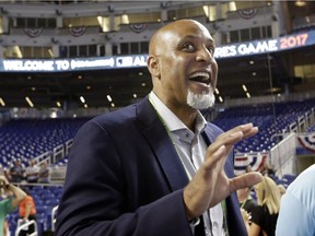 FILE - In this July 9, 2017, file photo, Tony Clark, head of the MLB Players Association, stands on the field before the All-Star Futures baseball game in Miami. Baseball players and management appear headed to early labor negotiations that could lead to significant economic changes in the collective bargaining agreement and possibly a new deal past the current expiration of December 2021. Management backed off its desire for a pitch clock this year, putting off most on-field changes to at least 2020. The biggest alterations discussed for this year are a single trade deadline and lowering the number of mound visits without a pitching change.