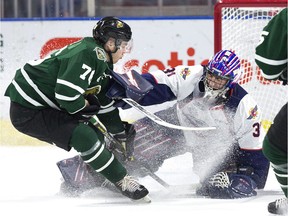 London Knights forward Billy Moskal sprays Windsor Spitfires goalie Colton Incze during Sunday's 5-0 London win in Game 2 of the Western Conference quarter-final series.