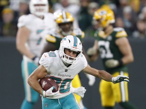 Miami Dolphins' Danny Amendola runs after a catch during the first half of an NFL football game against the Green Bay Packers, in Green Bay, Wis. The Detroit Lions signed Danny Amendola, giving them a slot receiver they missed after trading Golden Tate to Philadelphia last season. Detroit made the move Monday, March 11, 2019, to add another former New England Patriot to the organization.  Amendola had 59 receptions for 575 yards and one touchdown last season with the Miami Dolphins after playing for New England from 2013-17 and winning two Super Bowls.