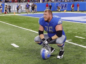 FILE - In this Sept. 24, 2017, file photo, Detroit Lions offensive guard T.J. Lang during an NFL football game against the Atlanta Falcons in Detroit. Lang was going through the concussion protocol Thursday, Nov. 9, 2017, three days after he played in a win at Green Bay.