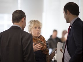 Philippa von Ziegenweidt, centre, speaks with lawyers representing Citizens for an Accountable Mega-Hospital Planning Process, during the Local Planning Appeal Tribunal (LPAT) Case Management Conference at Windsor City Hall, Wednesday, March 20, 2019.