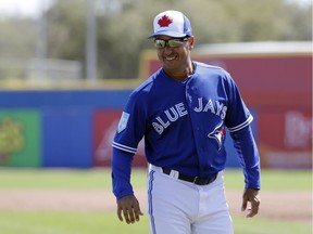 FILE- In this Thursday, Feb. 28, 2019, file photo, Toronto Blue Jays manager Charlie Montoyo watches during a spring training baseball game against the Philadelphia Phillies in Dunedin, Fla. Montoyo thought he would be taking a hard line against video games in his first year as Blue Jays manager. Before he could put his foot down on Fortnite, the players took it upon themselves to govern their gaming.
