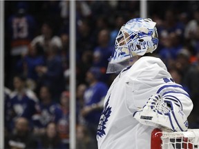 Toronto Maple Leafs goaltender Garret Sparks looks at a video replay on a screen above the ice after New York Islanders center Casey Cizikas scored a goal during the second period of an NHL hockey game, Thursday, Feb. 28, 2019, in Uniondale, N.Y.