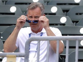 Gary Denbo puts on sunglasses as he sits in the stands at Roger Dean Stadium before the start of an exhibition spring training baseball game between the Miami Marlins and the Washington Nationals Friday, March 1, 2019, in Jupiter, Fla. A bond between two Yankees formed in early 1990s when Gary Denbo became Derek Jeter's mentor. Now they've changed teams and are trying to lead the Miami Marlins out of the wilderness, with Denbo playing a key role as vice president of scouting and player development.