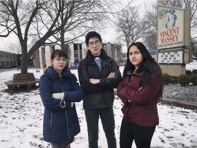 Vincent Massey Secondary Students Georgia Berg, 16, left,  Tailai Wang, 17, and Poonam Saha, 16, pose in front of the school on Thursday, March 7, 2019. They are among several students concerned about the proposal to end full year semester classes.