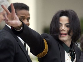 In this March 2, 2005 file photo, pop icon Michael Jackson waves to his supporters as he arrives for his child molestation trial at the Santa Barbara County Superior Court in Santa Maria, Calif.