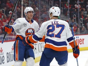 New York Islanders left wing Anders Lee (27) celebrates his goal with Brock Nelson in the first period of an NHL hockey game against the Detroit Red Wings, Saturday, March 16, 2019, in Detroit.