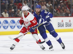 Detroit Red Wings center Frans Nielsen (51) and Tampa Bay Lightning center Steven Stamkos (91) battle for position in the first period of an NHL hockey game against the Tampa Bay Lightning, Thursday, March 14, 2019, in Detroit.