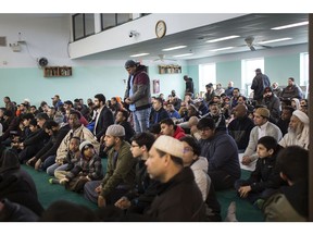 Horror ... and resolve. Local Muslims attend Friday prayers at the Windsor Mosque on March 15, 2019, a day after a gunman killed 49 people at two mosques in Christchurch, New Zealand.