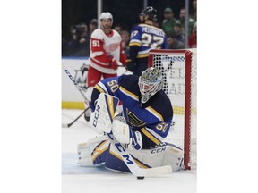 St. Louis Blues goaltender Jordan Binnington (50) makes a stick-save in the first period of an NHL hockey game against the Detroit Red Wings, Thursday, March 21, 2019, in St. Louis.