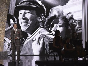 FILE - In this Sunday, Jan. 13, 2019, file photo, Smokey Robinson speaks at the "Aretha! A Grammy Celebration For The Queen Of Soul" event at the Shrine Auditorium in Los Angeles. The special is set to air on March 10, 2019, on CBS.